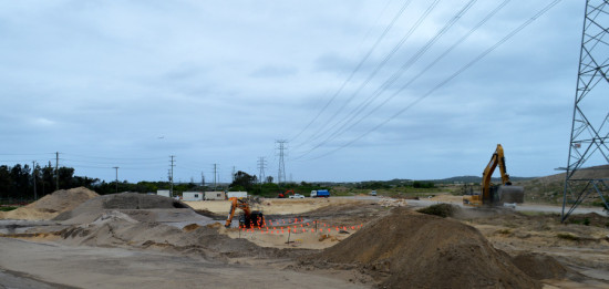 A large landscaped area, including frogpond, will be built between the eastern field and the access road to the fields.
